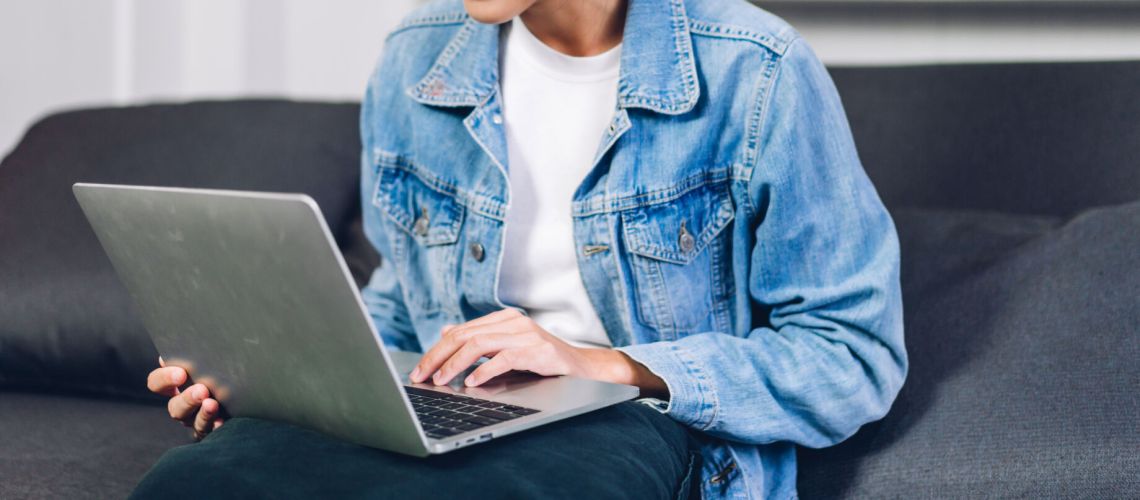 Young  woman relaxing using laptop computer working and video conference meeting at home.Young creative typing on keyboard.work from home concept